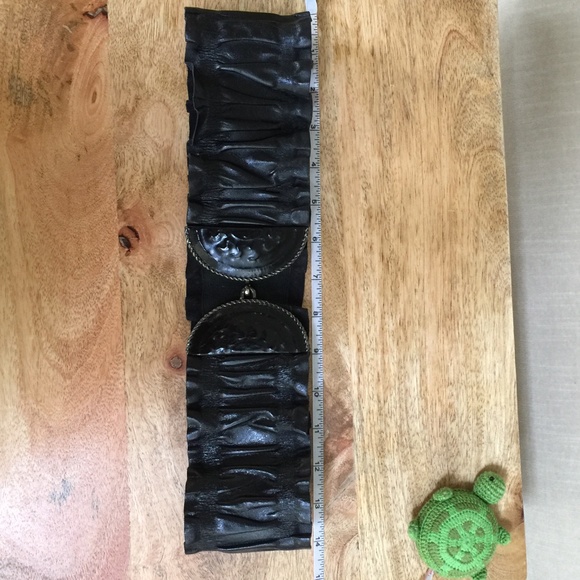 Black ruffled stretch belt with metal hook and loop buckle
